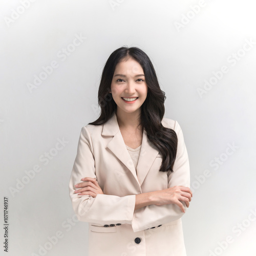 Studio portrait photo of young beautiful Asian woman in formal suit dressing with confident and luxury looking and attractive on white background studio shot.