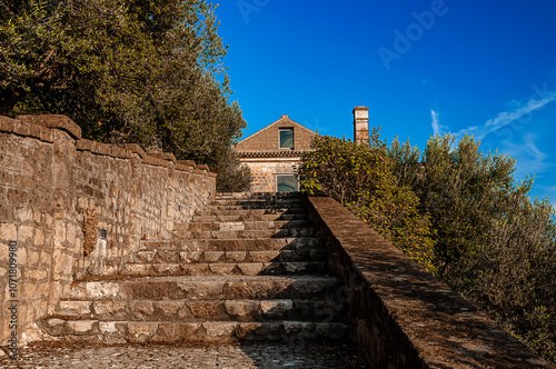 a stone staircase leads to the gardens of the palace of San Leucio photo