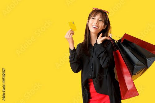 Young Asian woman with shop...