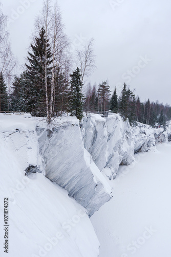 Winter in the park. Karelia Ruskeala Nature Reserve in winter. It is snowing in the forest.