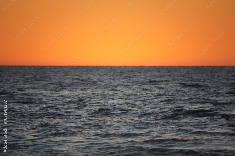 Sunset on the background of the river. Beautiful bright seascape. Sunset on the background of the river. Beautiful bright seascape.