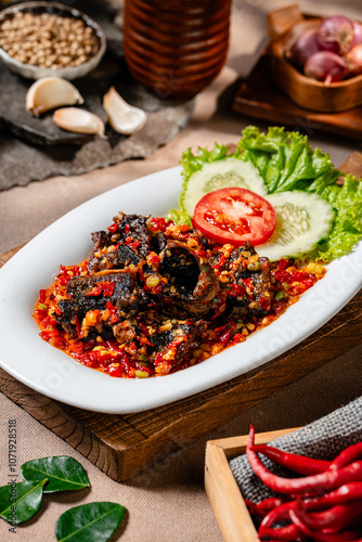 Fried eel or belut goreng with sambal balado is a Indonesian traditional food  photo