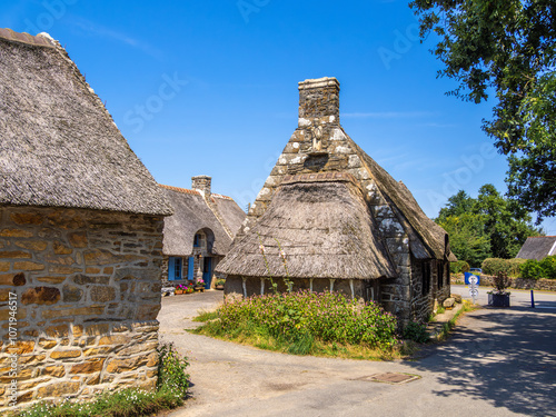 Thatched roof cottage houses in Kerascoet, Brittany photo