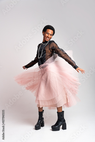 Fluid gender hispanic latin black man posing in studio with fashionable clothing, concepts about LGBTQ, genderless and diversity photo