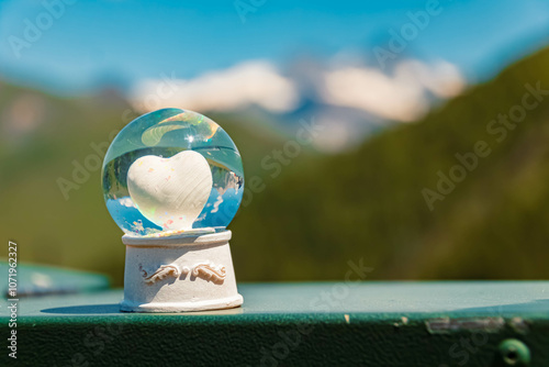 Crystal ball, with a heart inside, alpine summer landscape shot at Mount Goldried, Matrei, Eastern Tyrol, Austria photo