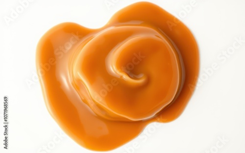 A close-up of a caramel swirl on a white background