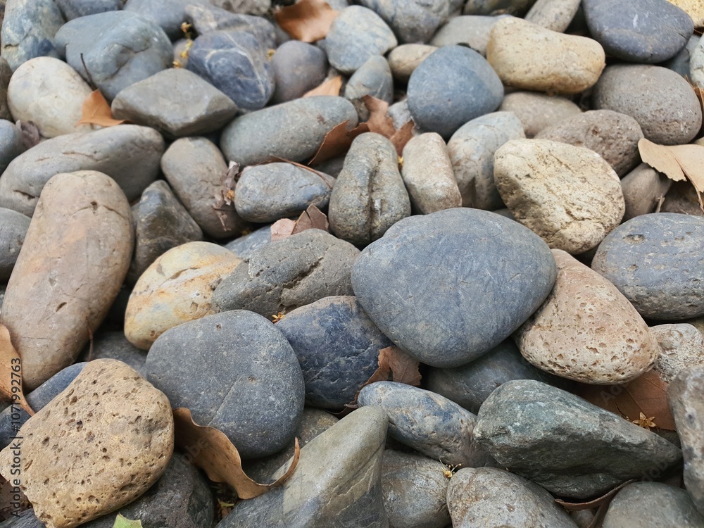 A collage of gray river rocks A collage of gray river rocks