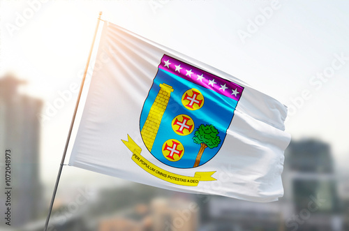 Contagem of Brazil flag waving on the top sunrise mist fog	