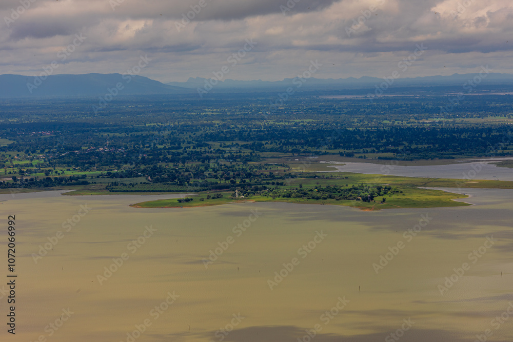 Panoramic nature background from a viewpoint on a high mountain overlooking the scenery below, river, road, rocks, trees, the beauty of nature during a trip in Khon Kaen, Thailand. Panoramic nature background from a viewpoint on a high mountain overlooking the scenery below, river, road, rocks, trees, the beauty of nature during a trip in Khon Kaen, Thailand.