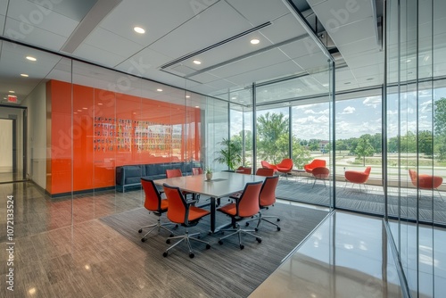 Modern conference room designed with glass walls and vibrant orange accents, overlooking a green landscape in a corporate office