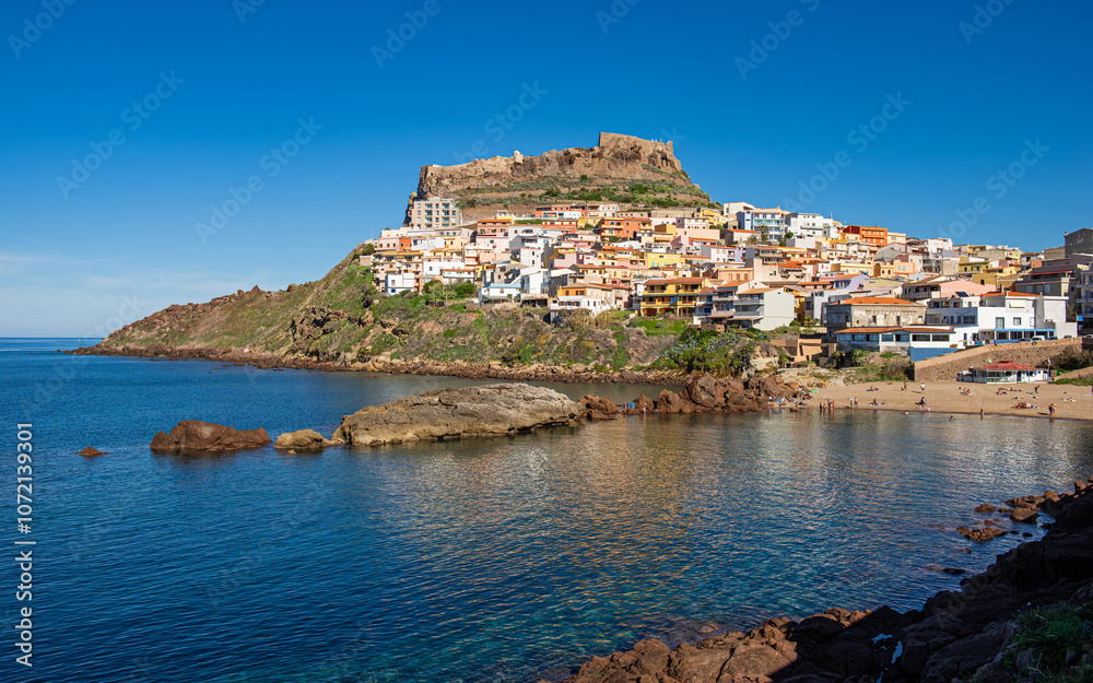 Fototapeta premium View of Castelsardo with beach and the fortress high up on the cliffs, Sassari, Sardinia, Italy
