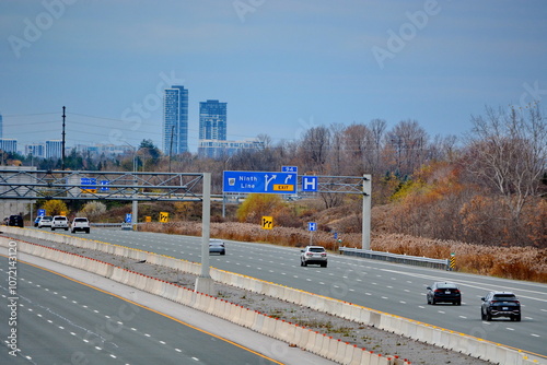 Wall Mural Ontario, Canada, November 8, 2024: Traffic and road signs on Highway 407 near Markham, Ontario