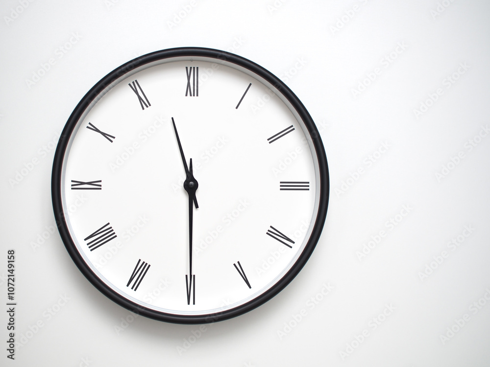 Clock Showing 23.30/11.30 with Roman Numerals – Simple Round Clock for Concepts of Time Management and Scheduling. Clock Showing 23.30/11.30 with Roman Numerals – Simple Round Clock for Concepts of Time Management and Scheduling.