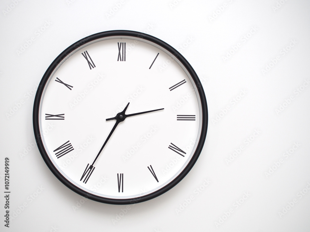 Clock Showing 14.35/02.35 with Roman Numerals – Simple Round Clock for Concepts of Time Management and Scheduling. Clock Showing 14.35/02.35 with Roman Numerals – Simple Round Clock for Concepts of Time Management and Scheduling.