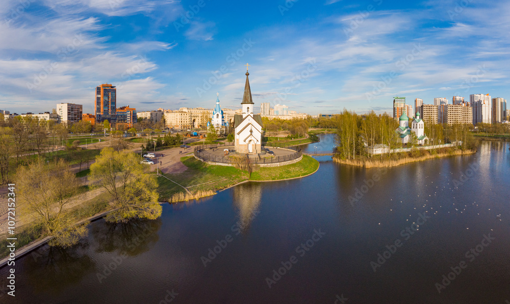 Naklejka premium Aerial top View to St. George the Victorious Georgievskaya, Sergius Of Radonezh and Church Nativity of Christ and Srednerogatsky pond. Pulkovsky park. Saint Petersburg. Russia. Europe