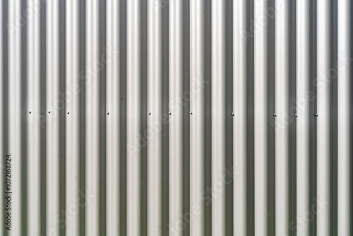 Corrugated metallic cover sheets, attatched with bolts to an industrial container for protection. Background use. photo