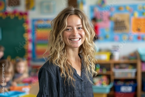 Portrait of a smiling young female teacher in a classroom
