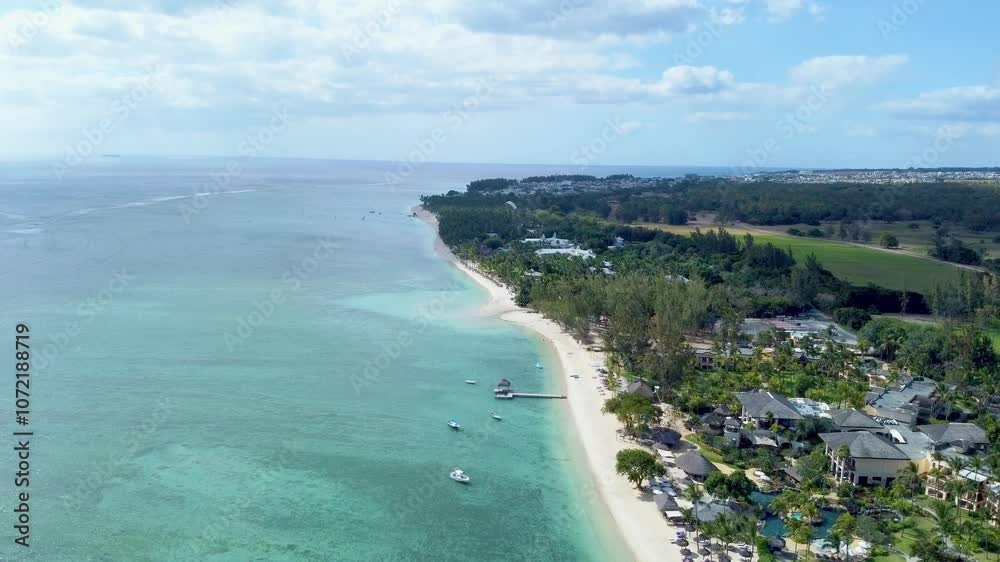 Aerial view in Mauritius over Flic en Flac area and it's beach, a beautiful tropical place in the Indian Ocean Aerial view in Mauritius over Flic en Flac area and it's beach, a beautiful tropical place in the Indian Ocean