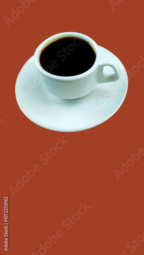 Isolated cup of coffee on the red background. 