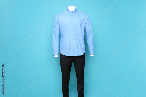 Wallpaper Mural Male mannequin with stylish shirt and pants on light blue background Torontodigital.ca