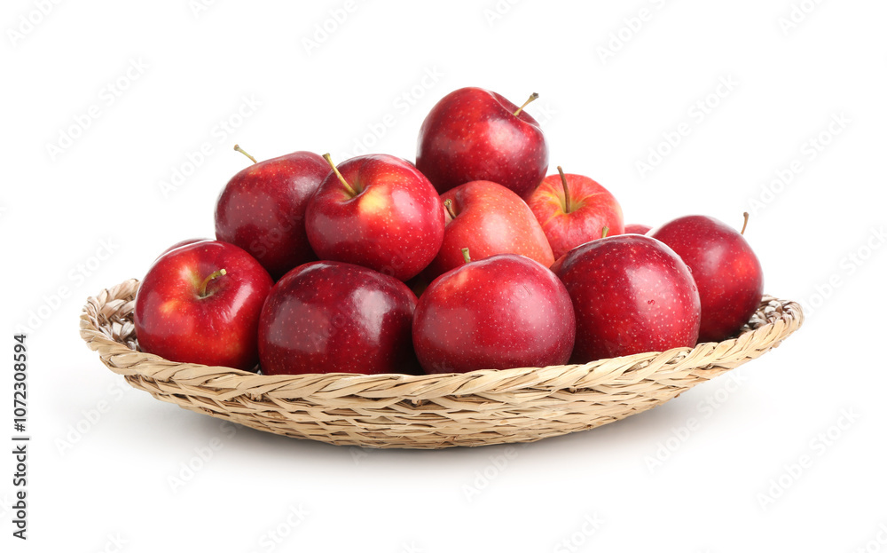 Fresh ripe red apples in wicker bowl isolated on white Fresh ripe red apples in wicker bowl isolated on white