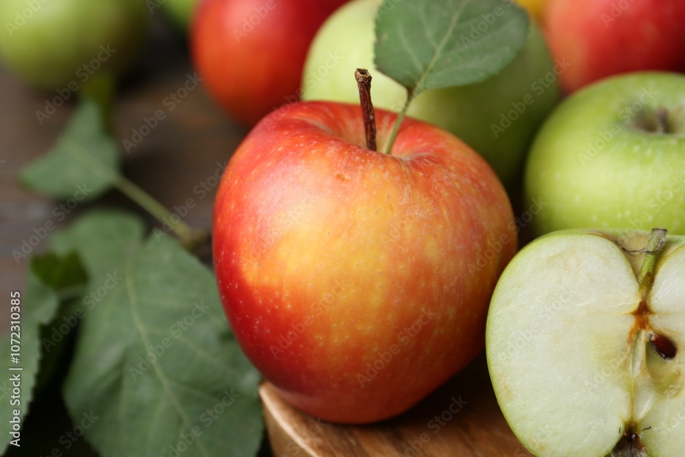 Different ripe apples on wooden table, closeup Different ripe apples on wooden table, closeup