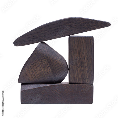 An abstract figure made of wood, isolated on a white background, dark in color.