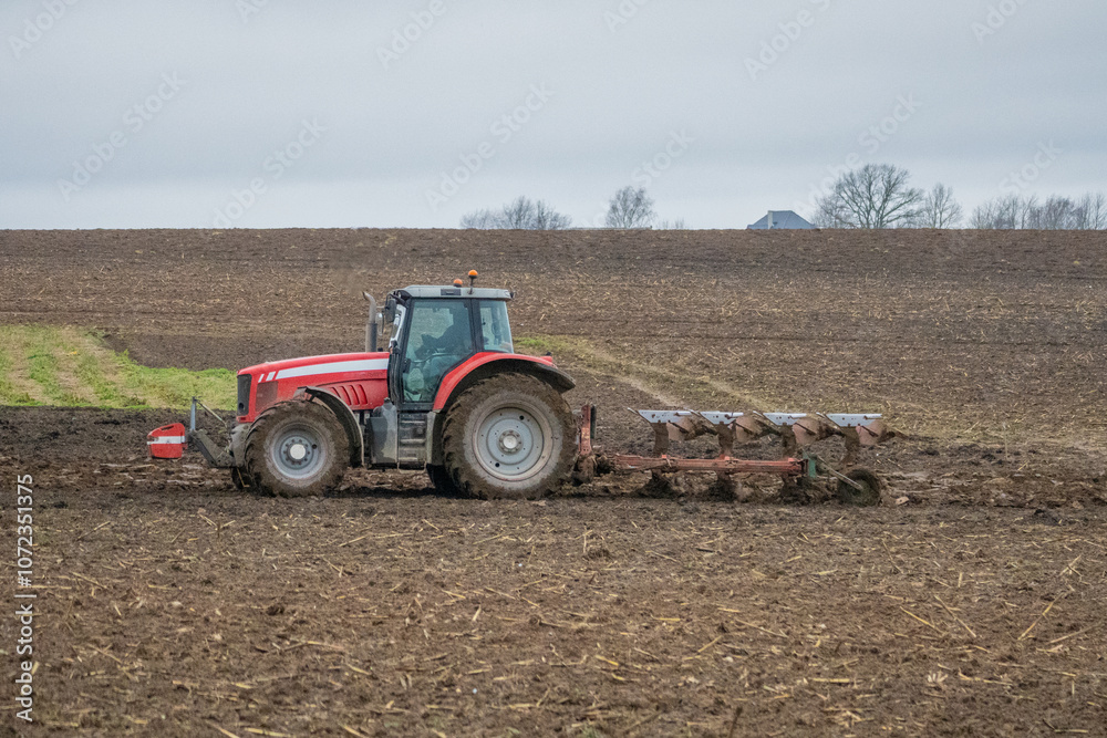 Obraz premium view of a tractor and its plow close up.