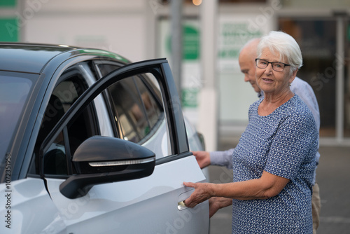 Elderly Couple Exiting Car Together