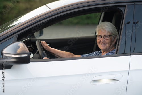 Elderly Woman Smiling While Driving