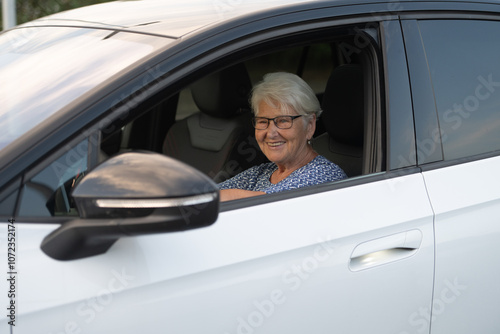 Elderly Woman Smiling While Sitting in Car