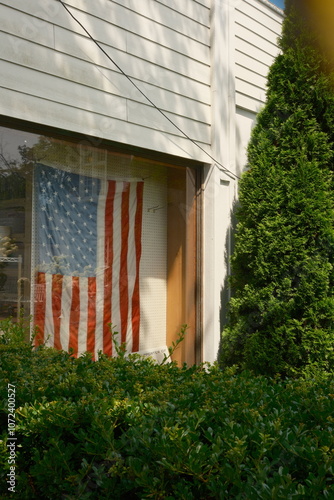 american white wooden building with stars and stripes flag 
