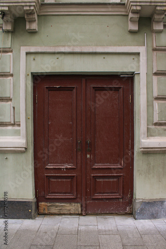 On the front wall is a beautifully crafted wooden door