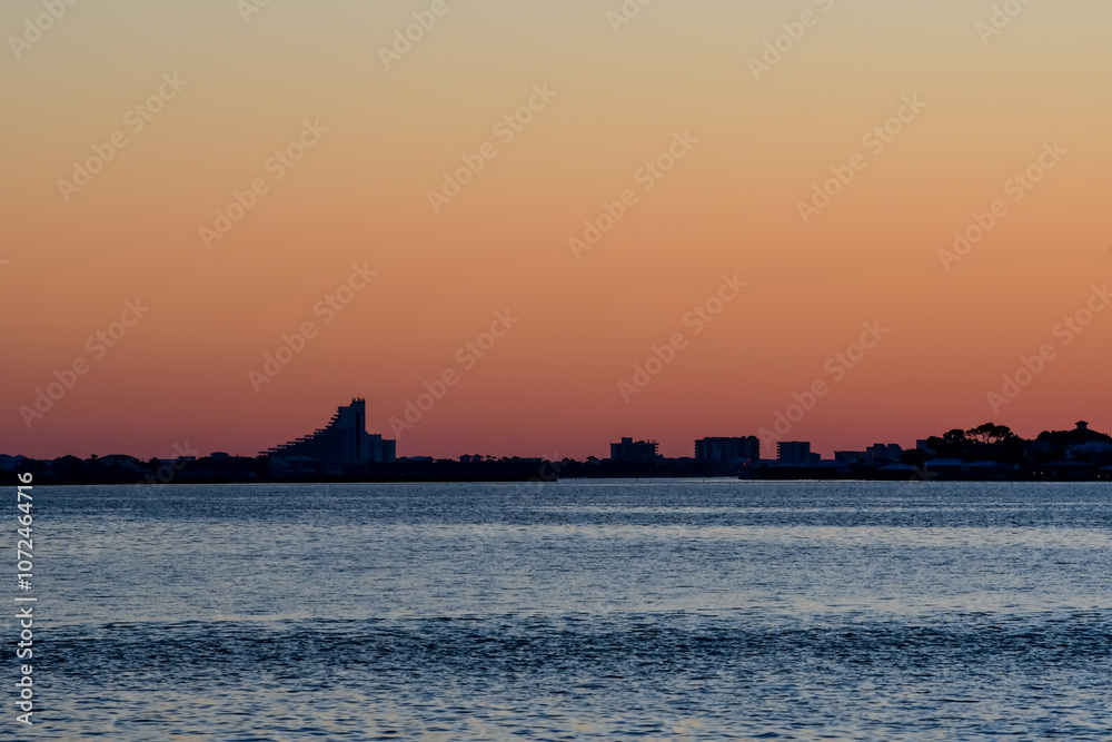 October Orange Sunset over a barrier island by the Intracoastal Waterway in Perdido Key, Florida October Orange Sunset over a barrier island by the Intracoastal Waterway in Perdido Key, Florida