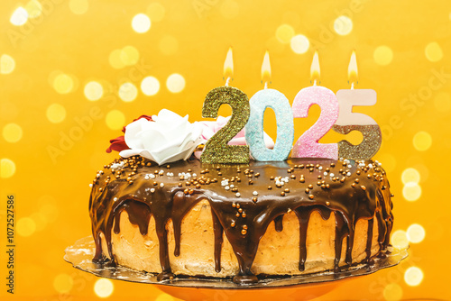 2025 new year birthday cake chocolate and cream decorated with numbers candle and flowers