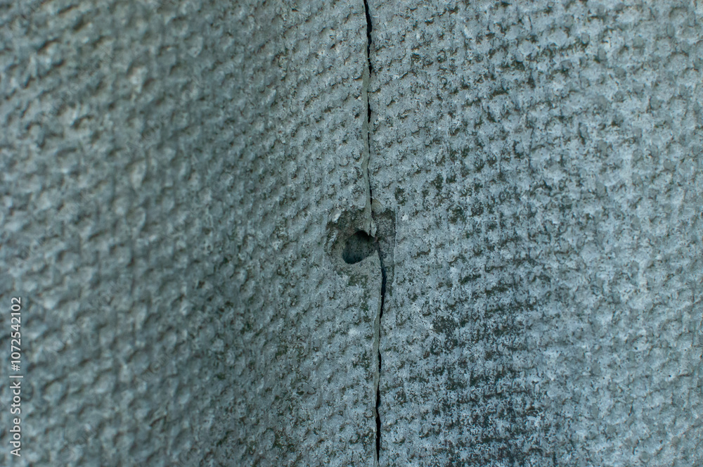 Gray slate with crack and hole Gray slate with crack and hole