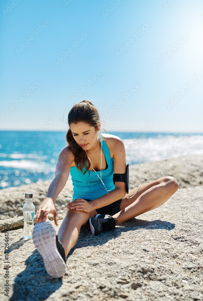 Stretching, music and fitness with woman in nature for start, streaming podcast and workout. Earphones, health and exercise with person and warm up at beach for running, marathon runner or training Stretching, music and fitness with woman in nature for start, streaming podcast and workout. Earphones, health and exercise with person and warm up at beach for running, marathon runner or training