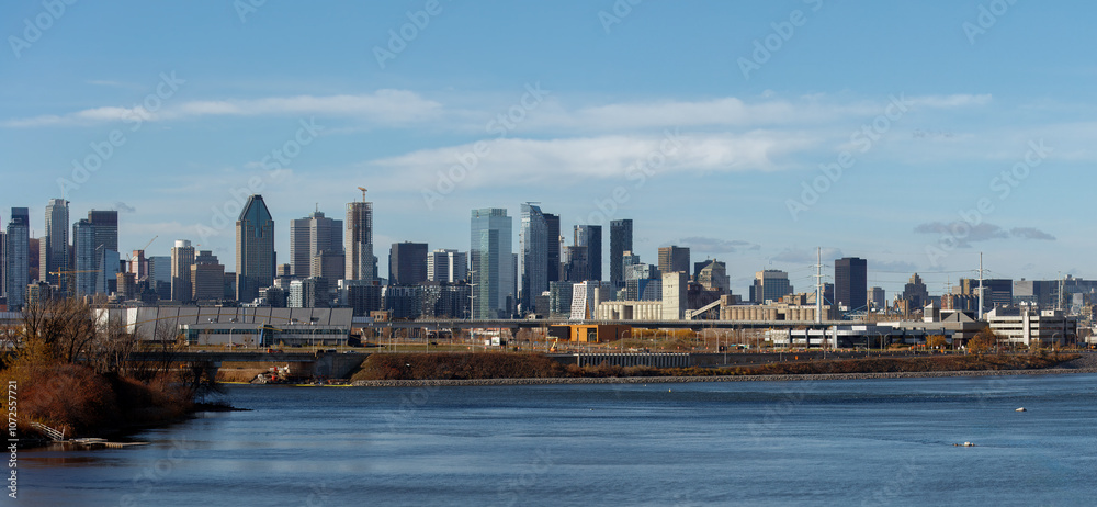 Naklejka premium Montreal Downtown Cityscape with St Lawrence River Cityscape Skyscraper Water and Sky