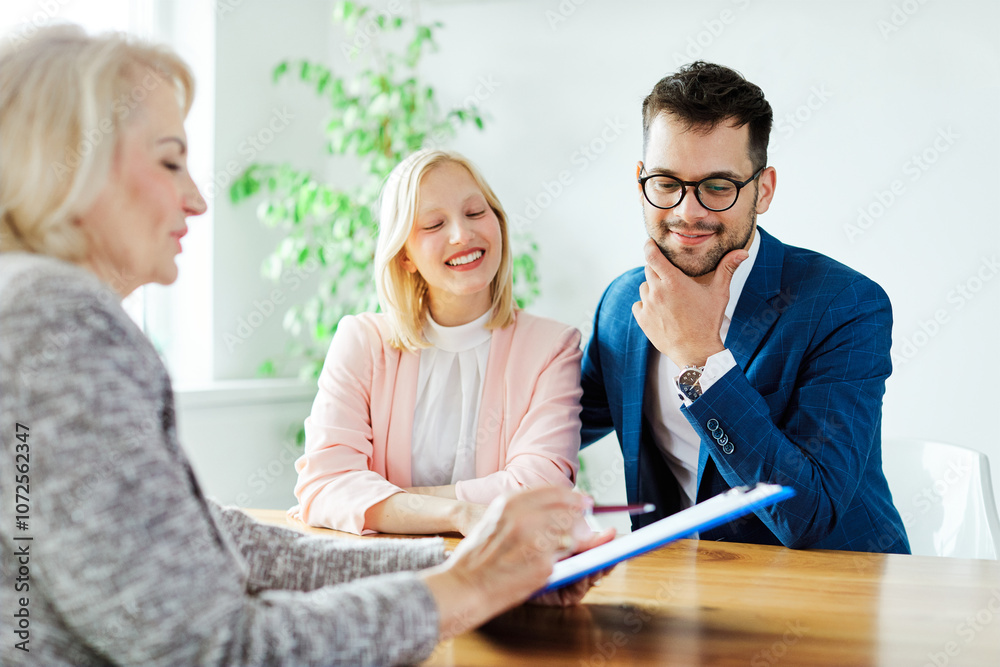 Fototapeta premium couple house property agent home business buying investment real estate apartment showroom office contract deal document agreement sign signing showing explaining