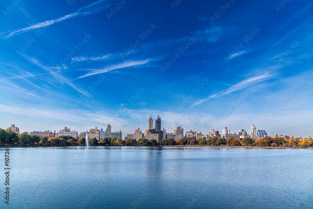New York, New York, USA – October 30, 2024: View of the Jacqueline Kennedy Onassis Reservoir and Central Park West in New York, New York, USA. New York, New York, USA – October 30, 2024: View of the Jacqueline Kennedy Onassis Reservoir and Central Park West in New York, New York, USA.