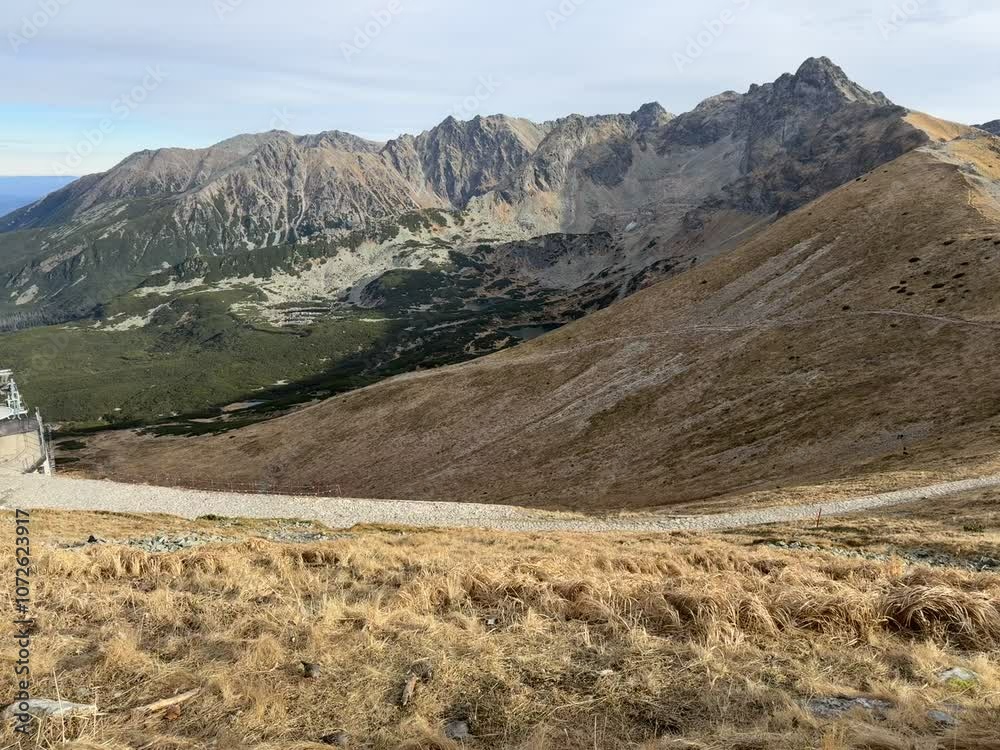 Panoramic views from Mount Giewont, Tatra Mountains, Poland, revealing sweeping landscapes and majestic peaks Panoramic views from Mount Giewont, Tatra Mountains, Poland, revealing sweeping landscapes and majestic peaks