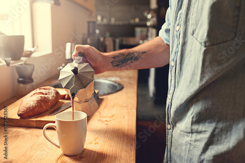 Home, kitchen and hands of person with coffee in moka pot for caffeine beverage, warm drink and cappuccino. Apartment, morning and man with espresso maker on counter for breakfast, aroma and wellness photo