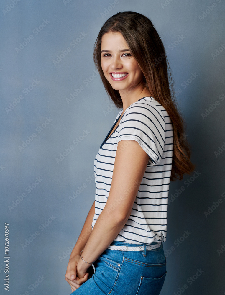 Portrait, woman and fashion at wall background with smile, confidence and makeup. Happy girl, student and relax in studio space with cosmetics, peace and posture pose for college drama portfolio
