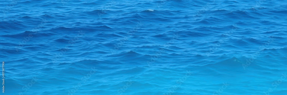 Obraz premium Abstract blur of ocean waves with gradient shades of blue, texture, waves