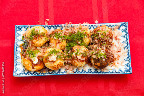 Delicious Takoyaki, a famous and traditional Japanese street food photo