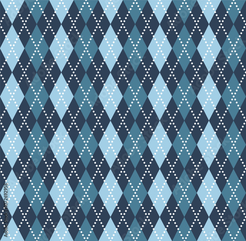 Argyle seamless pattern in cold colors. Geometric checkerboard pattern of diamonds and lines. Classic pattern for knitted winter sweaters and vests.