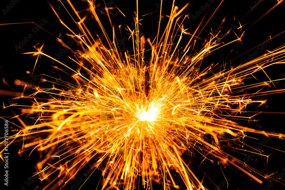 Sparkler background. New year sparkler on black background. Christmas sparkler backdrop. Fiery sparks backgrounds. Background for copy space. Firework effect. Bright sparkles background. Sparkler background. New year sparkler on black background. Christmas sparkler backdrop. Fiery sparks backgrounds. Background for copy space. Firework effect. Bright sparkles background.