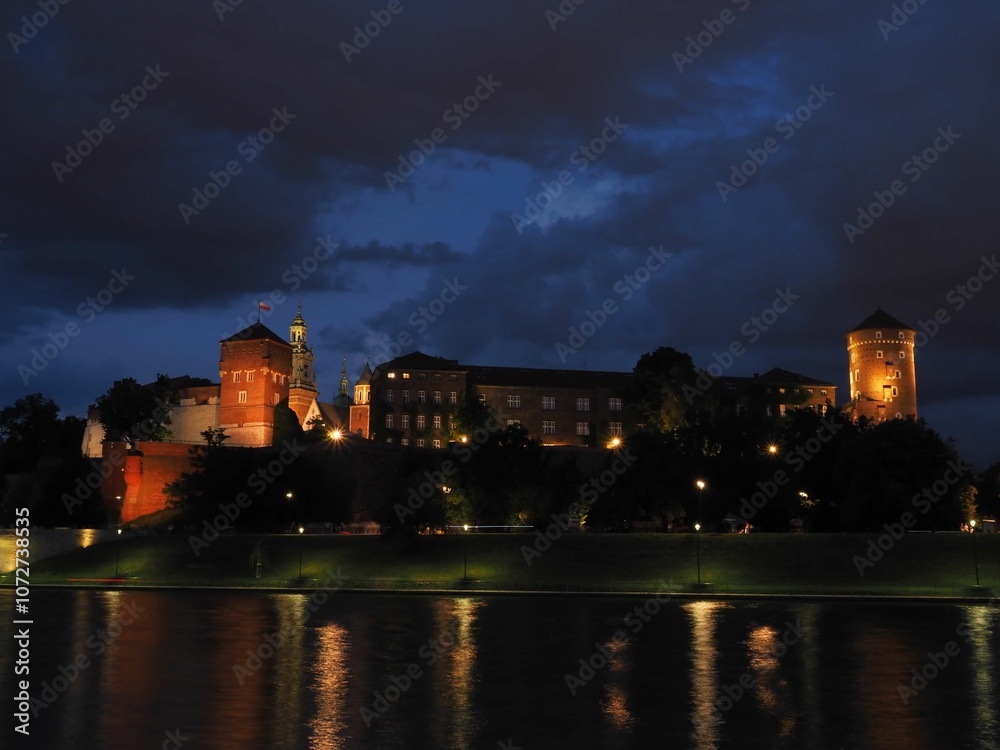 night view of Wawel Castle of Cracow Poland, seen from Vistula river night view of Wawel Castle of Cracow Poland, seen from Vistula river
