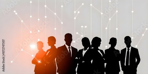 Silhouettes of business people in a corporate setting, with lights and a glowing background