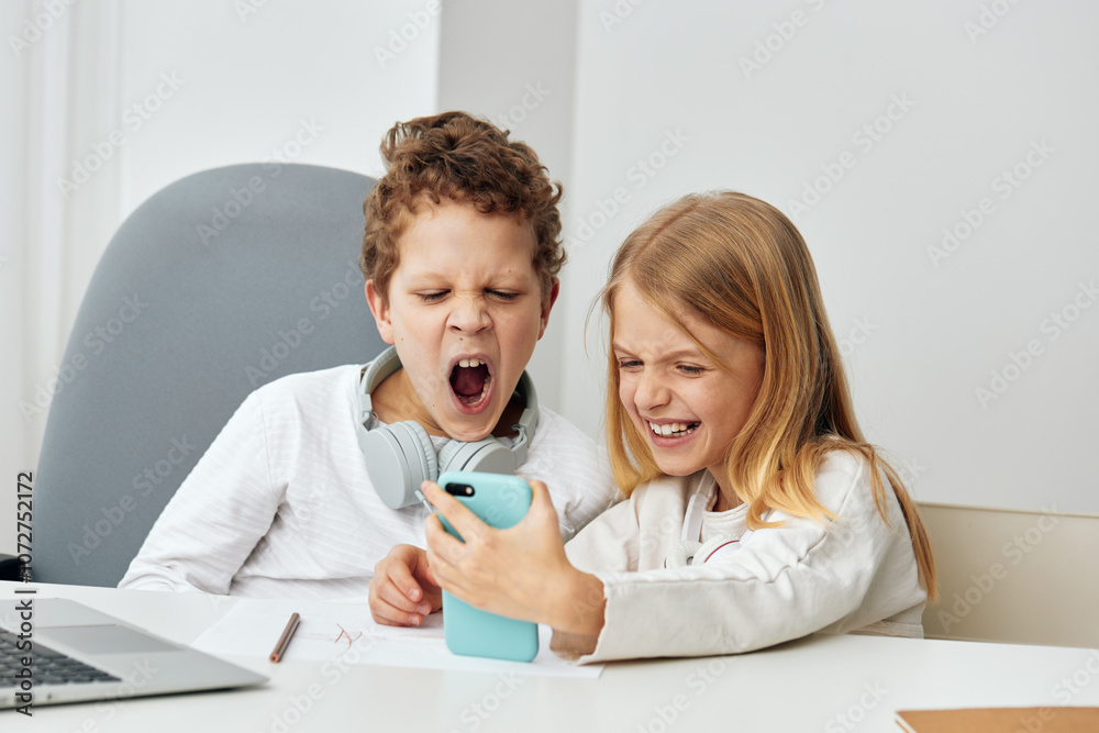 Happy Caucasian Boy and Girl Studying Online with Laptops at Home Happy Caucasian Boy and Girl Studying Online with Laptops at Home